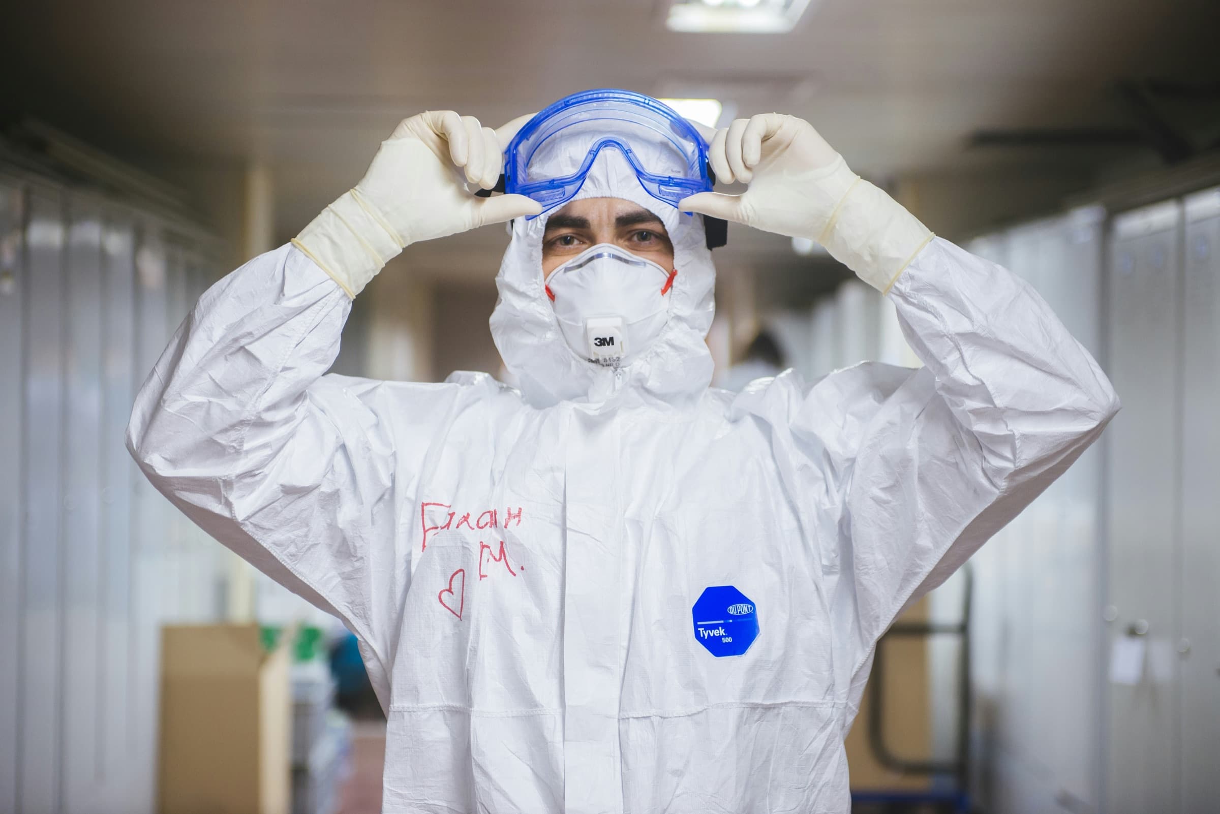 PPE worker preparing protective eyewear
